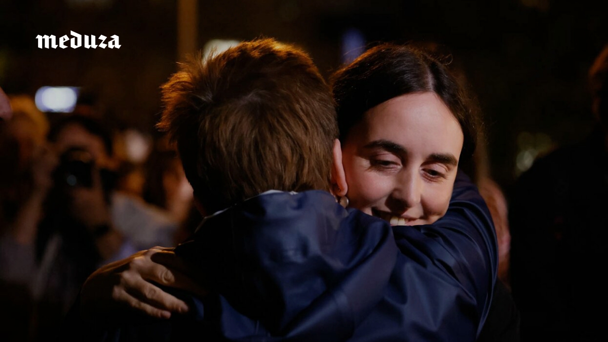 Supporters gather after charity founder is released under restrictions