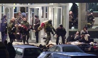 Before raiding the building, police use the ventilation system to flood the theater with knockout gas, after which Interior Ministry forces and FSB agents storm in. Officials say the terrorists’ explosives necessitated the use of knockout gas. The exact makeup of the gas pumped into the theater is still unknown to this day.