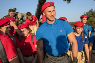 YouthArmy head and former bobsledder Dmitry Trunenkov (center) and a rally in “Patriot” park, August 18, 2017
