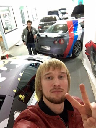 Andrey Plotnitsky (a.k.a. Kovalsky) and Kirill Slobodskoy, two members of Evil Corp, in a car repair shop alongside a car belonging to fellow Evil Corp member Dmitry Smirnov.