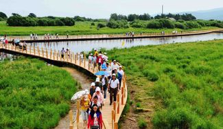 Tourists at the wetland park on China’s side of Bolshoy Ussuriysky Island, July 2011
