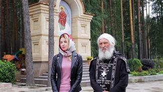 Natalia Poklonskaya stands beside Schema-Hegumen Sergii at the Sredneuralsk Women’s Monastery. August 20, 2019
