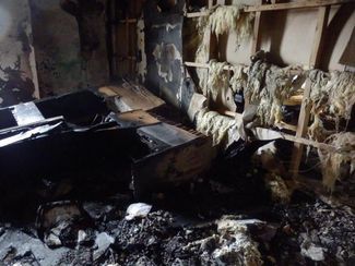 The Committee Against Torture Joint Mobile Group’s burnt lawyers’ office in Grozny, December 14, 2014.