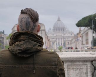 Gleb Erve’s head tattoo of the emblem of the Italian National Fascist Party