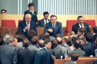 General Secretary of the CPSU Central Committee, USSR President Mikhail Gorbachev, First Secretary of the Communist Party of Kazakhstan Nursultan Nazarbayev, and First Secretary of the Communist Party of the RSFSR Ivan Polozkov. Presidium of the XXVIII Congress of the CPSU. Kremlin Palace of Congresses. July 2, 1990.