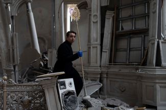 A church officer in the damaged Transfiguration Cathedral. July 23, 2023.