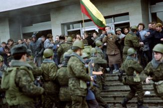 Soviet troops attacking pro-independence protesters in Vilnius. January 11, 1991.