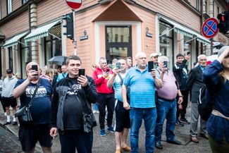 Onlookers watching the Riga Pride march. June 2022. 