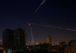 Trails from Ukrainian air defense systems trying to shoot down a Russian drone over Kyiv.