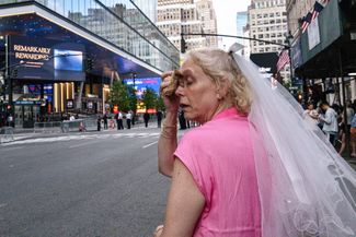 A Taylor Swift fan waits outside Madison Square Garden during the heat, hoping to see the singer. July 3, 2026
