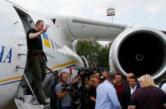 Ukrainian filmmaker Oleg Sentsov, convicted of plotting terrorist attacks in Russia, steps out from a plane in Kyiv after Russia and Ukraine <a href="https://meduza.io/en/feature/2019/09/07/russia-and-ukraine-begin-highly-anticipated-prisoner-exchange-this-story-is-developing" target="_blank">exchange dozens of prisoners</a>. September 7, 2019.