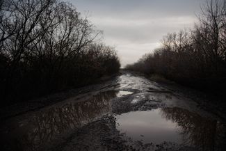The damaged road leading to the village of Spodobivka