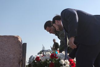 Alexander Zakharchenko and Denis Pushilin lay flowers at the memorial to the victims during a ceremony on the first anniversary of the MH17 crash, outside Grabovo.