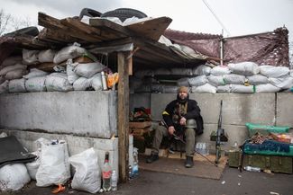 A soldier in Ukraine’s Territorial Defense Forces at a checkpoint in Kyiv.