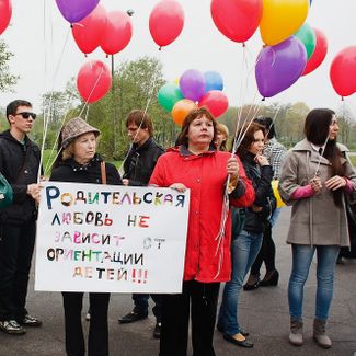 Parents’ Club activists Elena Musolina and Marina Melnik of the Vykhod organization. Sign in picture: "Parental love does not depend on a child’s orientation!!!"
