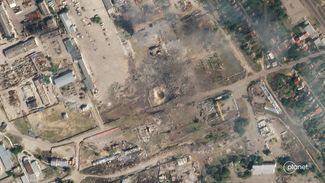 Место взрыва российского склада боеприпасов в промзоне в Новой Каховке. 12 июля 2022 года