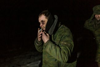 A fighter from one the “people’s republics” during a prisoner exchange in Novotoshkivske. Over the seven years after the signing of the Minsk agreements, the ceasefire along the line of contact was violated frequently — with both sides accusing each other violations.