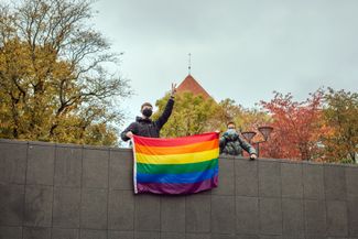 Two young people display a rainbow flag on Tallinn’s Freedom Square. October 2020.