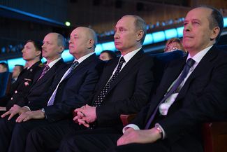 Russian Foreign Intelligence Service chief Mikhail Fradkov (3rd left), Russian president Vladimir Putin and Russian Federal Security Service (FSB) head Alexander Bortnikov attend a gala evening marking the Security Agency Worker's Day at the State Kremlin Palace. December 20, 2014