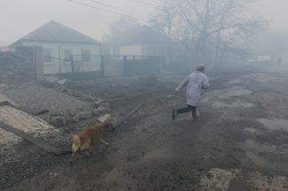 Khartsyzska street in Donetsk region after rocket explosion - probably HIMARS MLRS
