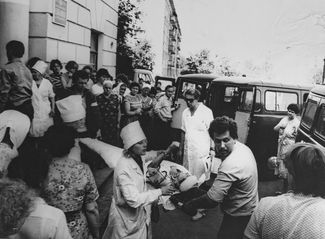 The wounded are loaded into an ambulance. June 4, 1988.