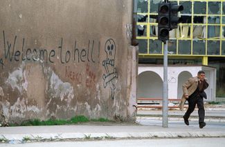 A Sarajevo resident on the city’s main street, Zmaja od Bosne, in April 1993. During the war, it was known as “Sniper Alley.” More than 200 civilians were killed there.