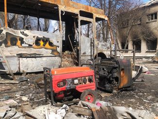 A burnt-out bus in the courtyard outside the school in Bohdanivka. April 11, 2022