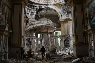 Church personnel inspect the damages inside the Transfiguration Cathedral in Odesa, Ukraine, following Russian missile attacks. July 23, 2023.