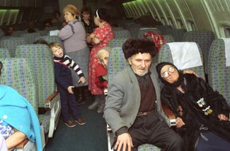 Armenian refugees from Baku on a plane to Moscow, 1990