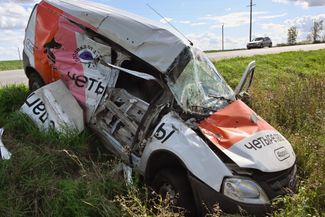 A destroyed ambulance on the side of the road in the Kursk region