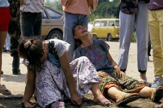 Refugees from Srebrenica who found out about the murder of their relatives. June 1995.
