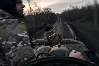 Ukrainian soldiers on the road leading to Avdiivka. February 14, 2024. 