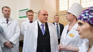 Mishustin joins health officials on a visit to a hospital in Kostroma on March 13, 2020