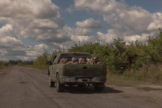 A Ukrainian truck transporting Russian prisoners of war