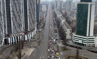 Long lines of cars attempt to leave Kyiv. February 24, 2022.