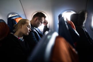 Navalny and his wife during a flight to Yekaterinburg, where his presidential campaign is opening a local headquarters. February 24, 2017.