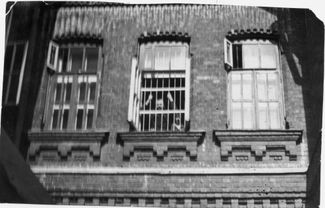 Soviet dissident Yuri Titov looks through a barred window at Kashchenko Psychiatric Hospital No. 1. Moscow, 1971.