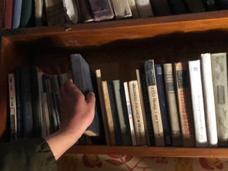 Bookshelves in the house where fighters from the Kulchitsky Battalion are currently living