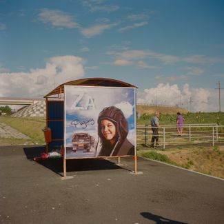 July 23rd 2022. Rostov Oblast, Russia. Pro-war propaganda image on a bus stop by the highway leading to the city of Rostov on the Don delta. The image features a child dressed in military attire, a military truck with a Z and the slogan "For the motherland".