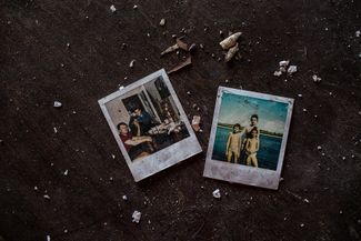 Family photos left in an abandoned apartment.
