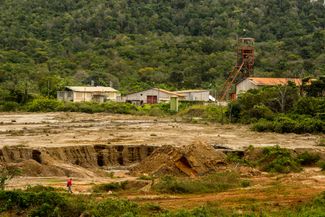 A miner walks on property owned by state gold processor Minerven in the violently contested, mineral-rich town of El Callao, Bolivar State, Venezuela. February 27, 2018