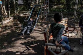 Displaced Armenian children from Nagorno-Karabakh play on the playground of a kindergarten serving as a temporary shelter. Masis, Armenia. October 8, 2023. 