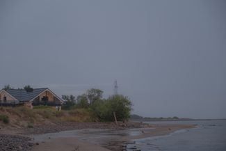 The vanishing coastline and houses on the water’s edge. Pāvilosta, July 2024. 