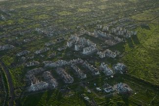 Residential buildings razed to the ground and shell craters are seen on an aerial view of Maryinka, an eastern city where heaviest battles with the Russian troops have been taking place in the Donetsk region, Ukraine, Thursday, May 11, 2023. (AP Photo/Libkos) XEL120
