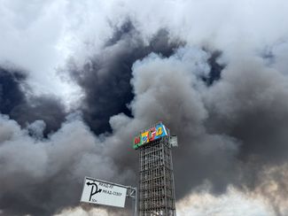 Smoke from fires in the Mega Belaya Dacha shopping center area