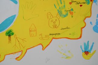 Childrens’ drawings on a wall at the shelter