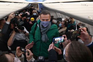 Alexey Navalny boards a plane in Berlin to return home to Moscow, where he is arrested almost immediately. January 17, 2021.