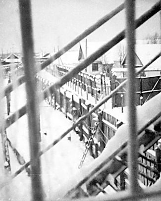 A photo of the Perm-36 camp, taken by Ivan Kovalev from the exterior staircase to the second floor. "I let my escort walk ahead, I coughed (to muffle the click of the photo shutter) and paused," he recalled.
