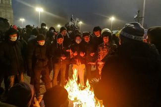 Protesters gathered around a bonfire in Almaty. January 5, 2022.