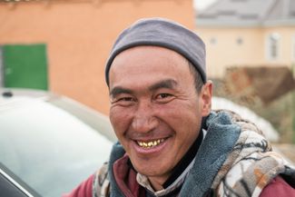 A member of Murat’s crew smiles after selling the gold they found that day.